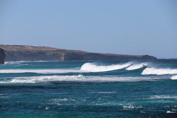 waves crashing on rocks