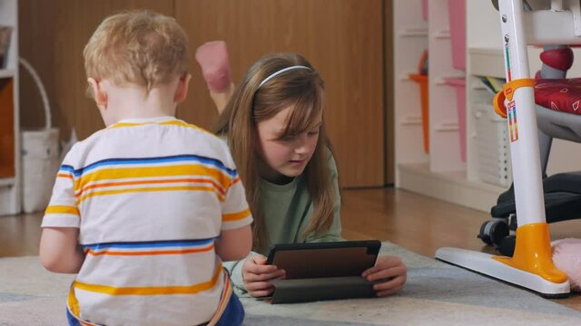Children with gadgets at home