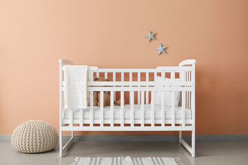 Comfortable crib in interior of stylish children's room