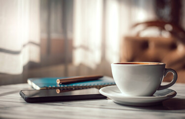 Close-up, white coffee cup with mobile phone and note book on table in retro cafe and vintage tone, concept people working past time and relax after work