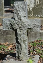 Roughly cut stone cross on a grave