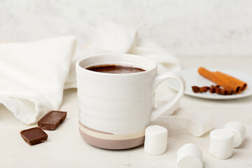 Obraz na płótnie Canvas Cup of natural hot chocolate with marshmallow on white background