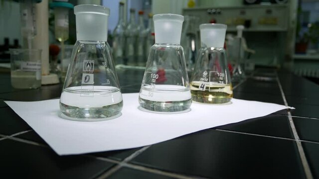Flasks with reagents in a chemical laboratory. Research of drugs in pharmacy
