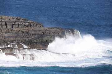 waves crashing on rocks