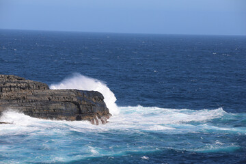 waves crashing on rocks