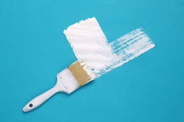 Brush paints white paint confirming check mark on blue background