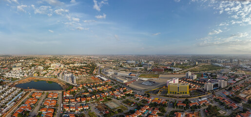 Fototapeta na wymiar Aerial drone photography of Talatona city in Belas, residential area with condominiums with luxury houses and luxury office buildings, in the metropolitan area of Luanda in Angola