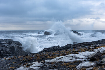 waves crashing on rocks Iceland