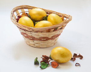 Easter golden eggs in a wicker vase