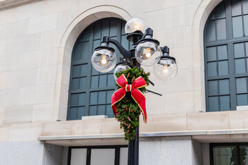 Ottawa, Canada - December 16, 2021: Street lamp decorated for Christmas season in downtown of...