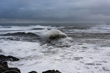 waves crashing on rocks Iceland