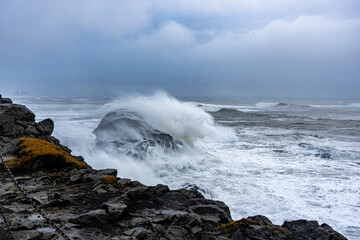 waves crashing on rocks Iceland