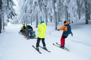 Fotobehang Skiers and snowmobile in winter nature © kovop58