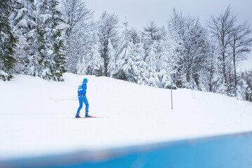 Blue nordic ski athlete