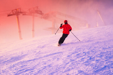 Skier in ski resort. Winter nature, silhouette, sunset sky