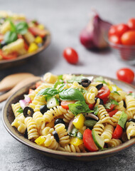A bowl with traditional Italian pasta salad