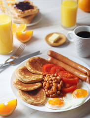 Traditional British breakfast with sausages and beans	