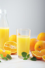Oranges and orange juice in glasses