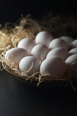 Chicken eggs in rustic style low key