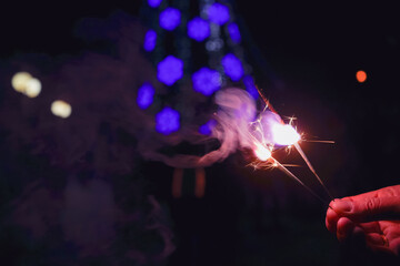 hand holding Bengal lights celebrating