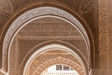 Interior arch of Alhambra -- a palace and fortress complex located in Granada, Andalusia, Spain. Islamic Moorish architecture.