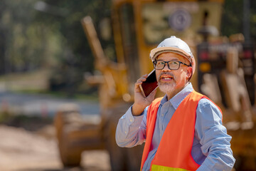 Surveyor builder Engineer technician  Business Team discuss plan at new construction site.