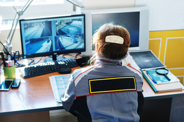 Security of the local area using video surveillance and monitors. A female operator monitors the...