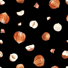 Seamless pattern of hazelnuts on black