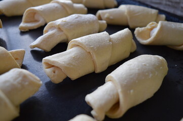 handmade rolls with cheese, from puff pastry ready to bake