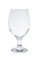 Empty glass made of transparent glass for cognac, brandy or rum on a thin leg. Isolated on a white background, close-up