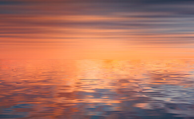 Naklejka na ściany i meble Relaxing and calm sea view at orange sunset