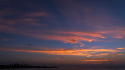 Fototapeta na wymiar Dusk sky over sea in the evening on twilight with dark blue hours after sundown 