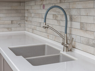Designer kitchen sink and faucet in the kitchen.