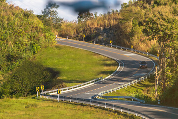 Curve road No. 3, or sky road on Root 1081 over top of mountains with green jungle in Santisuk - Bo Kluea District.