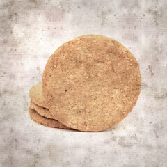 square stylish old textured paper background with round baked oatcakes