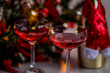 Two glasses of sparkly wine ready for romantic celebration of winter holidays