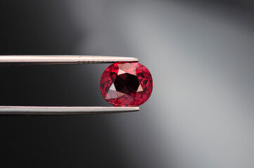 Genuine garnet gemstone. Cherry red rhodolite gem. Oval faceted in Thailand. Mined in Africa. Held...