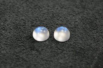 Blue sheen adularia moonstones round drop shaped cabochones matched calibrated pair. Milky white...