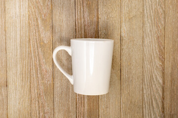 White Mug mockup on rustic wooden board for copy space add your logo 