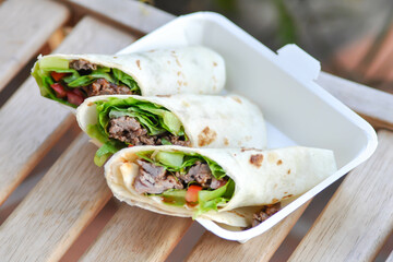 kebab ,pork wraps or taco or vegetable roll or mexican rolls or beef wrap