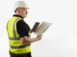 Male architect in reflective vest. Portrait of architect with construction drawings in his hands. Man in uniform builder. Employee of architectural company on white background. Architect with tablet