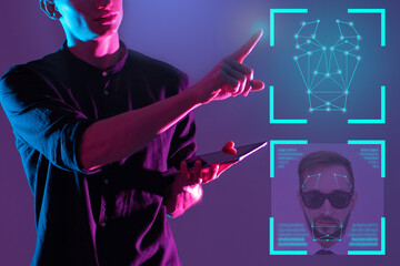 Human face recognition. Human identification using software. ID Face technology. Male virtual security specialist. Engineer deals with intensification software. Modern face recognition algorithms