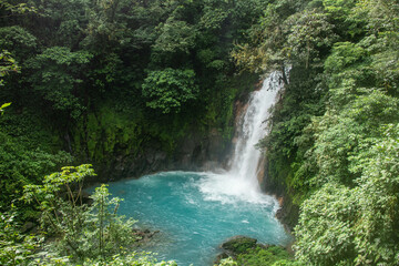 Naklejka na ściany i meble Turquoise Rio Celeste waterfall, Tenorio Volcano National Park, Guanacaste, Costa Rica