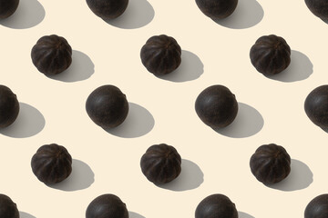 Black whole dried limes. Dried Lime is a spice used in Middle Eastern dishes. Seamless repeating pattern.