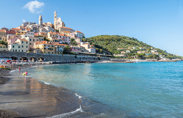 The beach of Cervo with his beautiful historic center in background