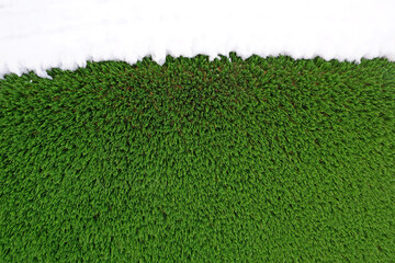 green surface made of artificial grass