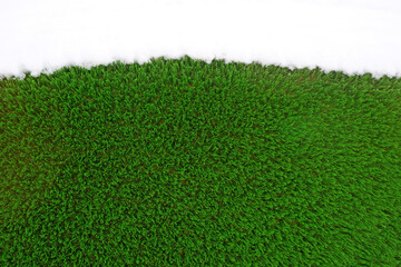 green surface made of artificial grass