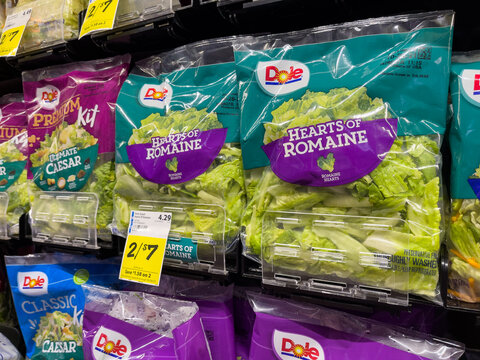 NORTH PORT, FL - January 01, 2022 : Dole bagged romaine salad lettuce on display at local grocery store.