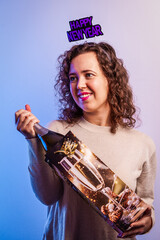 Young woman celebrating new year party with champagne