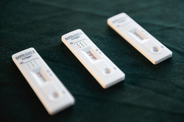 Negative and positive covid rapid self test with product box